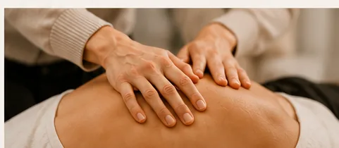 Placeholder photo: close-up of hands giving a hands-on assessment on someone's back.